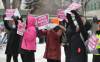 RUTH BONNEVILLE / FREE PRESS FILES
                                Healthcare workers picket outside the personal care home at 1010 Sinclair street on March 6.