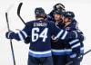 JOHN WOODS / THE CANADIAN PRESS
Winnipeg's Logan Stanley (64), Nikolaj Ehlers (27), Tyler Toffoli (73) and Nate Schmidt (88) celebrate the newly acquired Toffoli’s first goal with his new team Friday night.