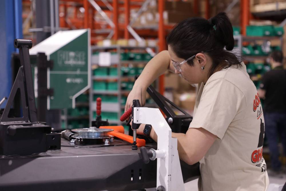 SUPPLIED
Yakta employee Olena Parneta, builds zero-turn mowers in an RM of Woodlands facility.