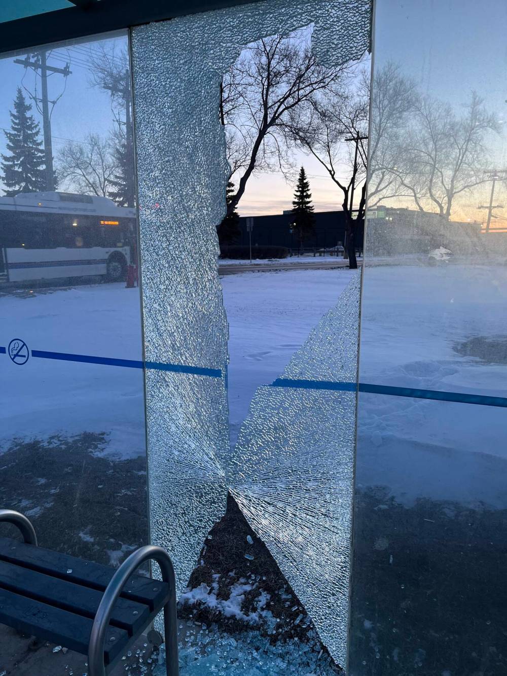 Russell Wangersky / Free Press
Sunrise is seen through broken bus shelter glass at McPhillips Street and Jarvis.