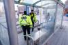 MIKE DEAL / FREE PRESS
                                Community safety officers check the wellbeing of a person in the bus stop outside City Hall.