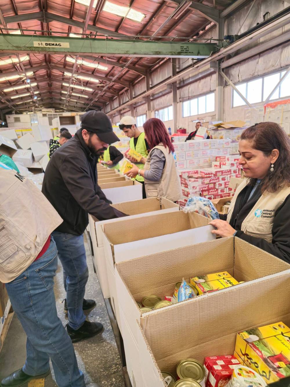 MCC staff pack emergency food packages in Amman, Jordan, to be dispatched to Gaza. (Submitted)