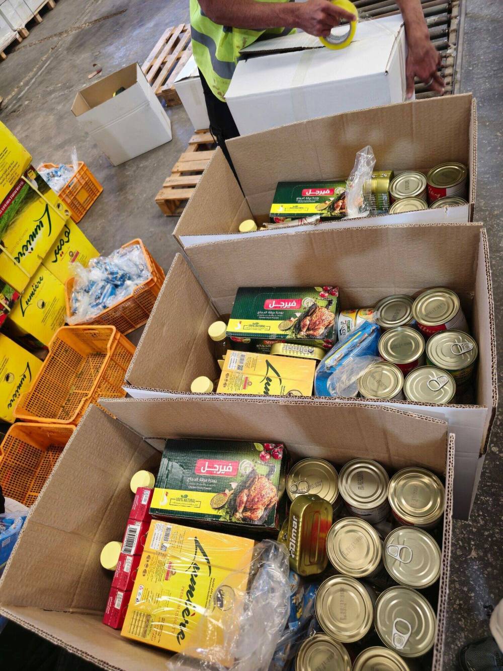 Completed emergency food packages are ready for closing and dispatch from Amman, Jordan, to Gaza. This is part of an initial pilot shipment of 665 food packages. (Submitted)