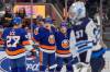 FRANK FRANKLIN II / THE ASSOCIATED PRESS
Islanders' Hudson Fasching (20) celebrates with teammates Mathew Barzal (13) and Anders Lee (27) after scoring a second-period goal on Winnipeg goaltender Connor Hellebuyck.