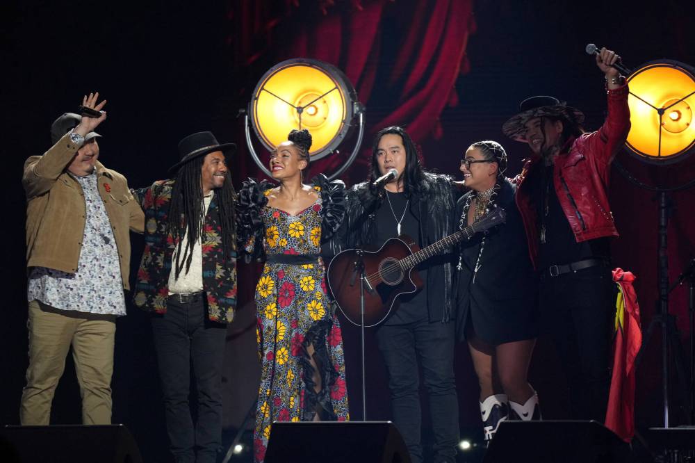 Darren Calabrese / The Canadian Press
Left to right: Manitoba’s William Prince joins Julian Taylor, Allison Russell, Aysanabee, Shawnee Kish and Logan Staats during a tribute to Robbie Robertson Sunday at the Junos.