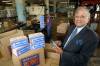 MIKE APORIUS/WINNIPEG FREE PRESS Nutty Club- Murray’s story Nutty Club President Jim Burt looks over boxes being shipped at the Alexander Street plant. July 07/2003