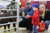 Three-and-a-half-year-old Lincoln Cuvelier feeds a goat in the the Royal Farm Yard petting zoo at the Royal Manitoba Winter Fair on Monday. (Michele McDougall / The Brandon Sun)