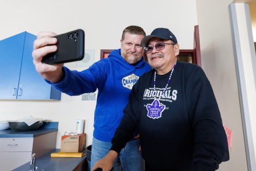 MIKE DEAL / FREE PRESS
Bombers Head Coach, Mike O’Shea, gets a selfie with Nick Harper, Director of Education at Red Sucker Lake FN.
Early Wednesday morning a contingent of coaches, players and staff with the Winnipeg Blue Bombers that included, Defensive Back’s Brandon Alexander and Nick Hallett, Head Coach, Mike O’Shea and General Manager, Kyle Walters, as well as mascots Buzz and Boomer travelled to schools in Garden Hill First Nation and Red Sucker Lake First Nation to meet with kids to sign autographs and teach them a bit about football.
See Jeff Hamilton story
240228 - Wednesday, February 28, 2024.