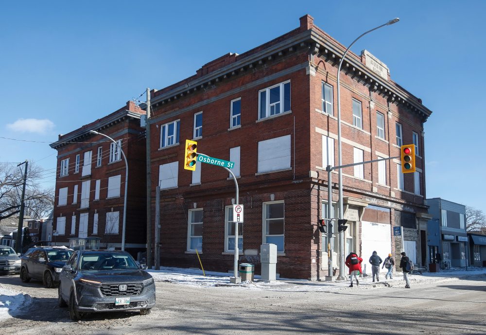 The property at 270 Morley Ave., known as the Rubin Block has sat vacant — and the doors and windows have been boarded up — since a fire on the third floor in 2014. (John Woods / Free Press)