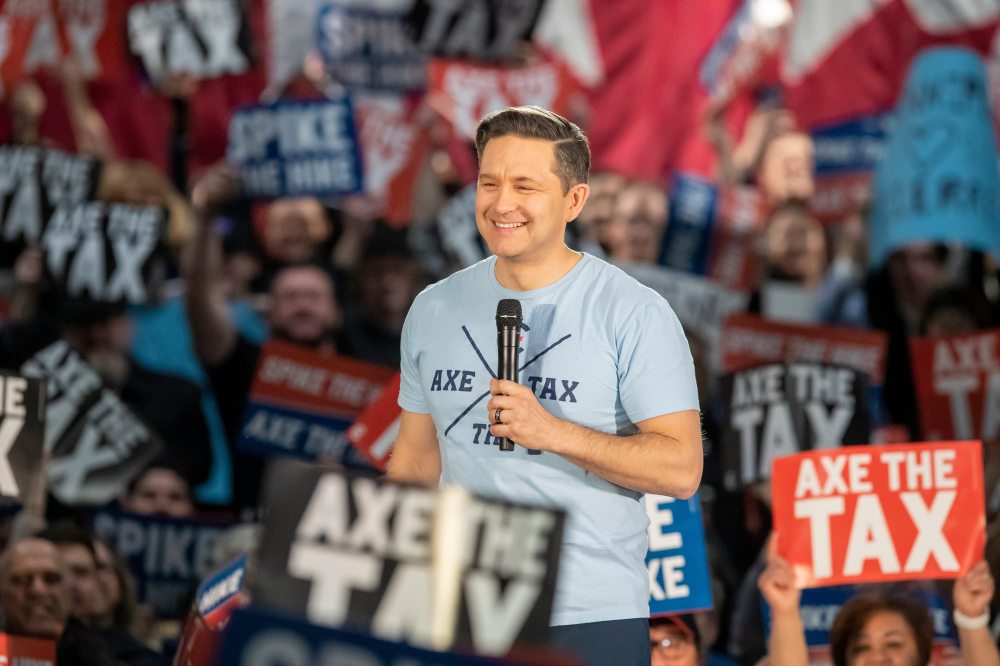 BROOK JONES / FREE PRESS Conservative Party of Canada Leader Pierre Poilievre is all smiles as he talks to a large crowd of supporters during his 'Spike the Hike - Axe the Tax' rally at the RBC Convention Centre in Winnipeg, Man., Thursday, March 28, 2024.