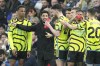 Arsenal's manager Mikel Arteta, second left, talks to his players during the English Premier League soccer match between Brighton and Hove Albion and Arsenal at the American Express Community Stadium in Brighton, England, Saturday, April 6, 2024. (AP Photo/Dave Shopland)