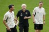FILE - Germany's then interim coaches Rudi Voeller, center, Hannes Wolf, right, and Sandro Wagner, left, lead the last training session ahead of an international friendly soccer match between Germany and France in Dortmund, Germany, Monday, Sept. 11, 2023. Rudi Völler is set to stay on as sporting director of the German men’s national soccer team through to the 2026 World Cup. (AP Photo/Martin Meissner, File)