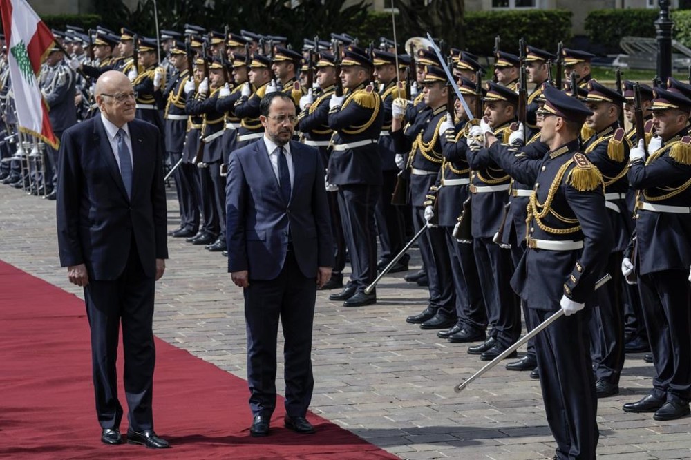 Cyprus' President Nikos Christodoulides, on carpet right, attends a military welcome ceremony with Lebanese caretaker Prime Minister Najib Mikati,on carpet left, upon his arrival to the government headquarters in Beirut, Lebanon, Monday, April 8, 2024. Christodoulides' visit to Beirut comes after he asked the European Union last week to intervene with Lebanese authorities to stop boatloads of Syrian refugees from heading to the east Mediterranean island nation. Lebanon's caretaker prime minister asked Southern European countries along the Mediterranean Sea to pressure the European Union to help Lebanon deport undocumented migrants. (AP Photo/Bilal Hussein)