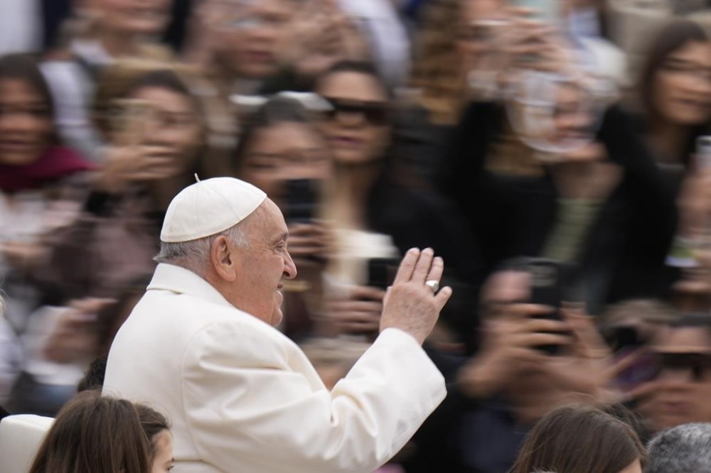 Pope Francis waves to the faithful as he arrives for his weekly general audience in St. Peter's Square, at the Vatican, Wednesday, April 3, 2024. A leading Canadian LGBTQ+ rights group says the Vatican's declaration that gender-affirming surgery and surrogacy are violations of human dignity is
