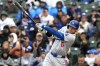 Los Angeles Dodgers' Shohei Ohtani, of Japan, hits a triple during the sixth inning of a baseball game against the Chicago Cubs in Chicago, Sunday, April 7, 2024. (AP Photo/Nam Y. Huh)