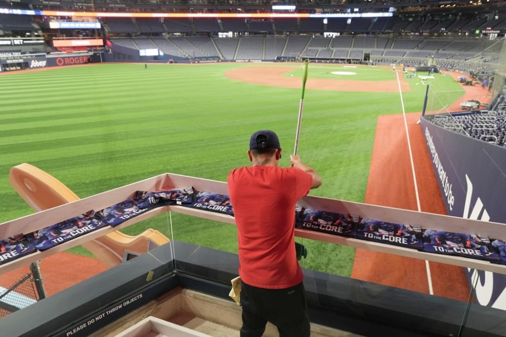 Last minute preparations for the home opener are made ahead of American League MLB baseball action between the Toronto Blue Jays and Seattle Mariners in Toronto, Monday, April 8, 2024. THE CANADIAN PRESS/Chris Young