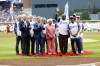 Billye Aaron, center, wife of the late Hank Aaron, stands with Georgia Gov. Brian Kemp, second from front left, Atlanta Braves chairman and CEO Terry McGuirk, front left, Dusty Baker, fourth from right, and players from the 1974 Braves team during a ceremony to mark the 50th anniversary of Hank breaking Babe Ruth's home run record team, before a baseball game against the New York Mets, Monday, April 8, 2024, in Atlanta. (Miguel Martinez/Atlanta Journal-Constitution via AP)