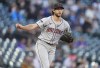 Arizona Diamondbacks starting pitcher Zac Gallen works against the Colorado Rockies in the first inning of a baseball game Monday, April 8, 2024, in Denver. (AP Photo/David Zalubowski)