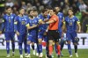 FILE - Bosnia and Herzegovina players argue with referee Halil Umut Meler during the qualifying soccer match between Bosnia-Herzegovina and Portugal, at the Bilino Polje Stadium in Zenica, Bosnia and Herzegovina, Monday, Oct. 16, 2023. UEFA's top referee has vowed to crack down on players arguing with referees and “mobbing” them on the field at the upcoming European Championship in Germany. (AP Photo/Armin Durgut, File)