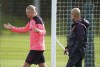 Manchester City's Erling Haaland, left, speaks with manager Pep Guardiola, during a training session at the City Football Academy, in Manchester, England, Monday April 8, 2024, ahead of a Champions League Quarter final, leg 1 soccer match against Real Madrid on Tuesday. (Mike Egerton/PA via AP)