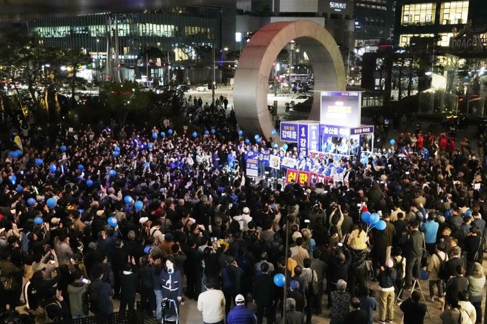 Supporters of main opposition Democratic Party gather during the party's parliamentary election campaign in Seoul, South Korea, Tuesday, April 9, 2024. The parliamentary election will be held on April 10. (AP Photo/Ahn Young-joon)