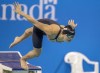 Maggie Mac Neil takes off from the start block on her way to winning the women's 100-metre LC butterfly at the Canadian swimming trials in Toronto on Wednesday, March 29, 2023. THE CANADIAN PRESS/Frank Gunn
