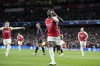 Arsenal's Bukayo Saka celebrates after he scored the opening goal during the Champions League quarter final first leg soccer match between Arsenal and Bayern Munich at the Emirates Stadium, London, Tuesday, April 9, 2024. (AP Photo/Frank Augstein)