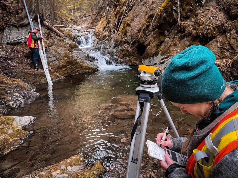 Paige Thurston, Columbia Basin Water Monitoring Framework program manager, right, completes a survey following a hydrometric install on Apex Creek in the Columbia Basin near Nelson, B.C. in this undated handout photo. A trio of experts in British Columbia says persistent drought is exposing cracks in how the province manages water, especially when it's scarce. THE CANADIAN PRESS/HO, Living Lakes Canada *MANDATORY CREDIT*