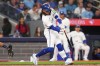 Toronto Blue Jays' Bo Bichette (11) hits a two-run home run against the Seattle Mariners during third inning American League MLB baseball action in Toronto on Tuesday, April 9, 2024. THE CANADIAN PRESS/Chris Young