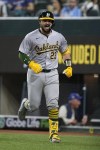 Oakland Athletics' Shea Langeliers celebrates his two-run home run against the Texas Rangers during the ninth inning of a baseball game in Arlington, Texas, Tuesday, April 9, 2024. Langeliers hit three home runs. (AP Photo/Tony Gutierrez)