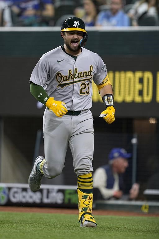 Oakland Athletics' Shea Langeliers celebrates his two-run home run against the Texas Rangers during the ninth inning of a baseball game in Arlington, Texas, Tuesday, April 9, 2024. Langeliers hit three home runs. (AP Photo/Tony Gutierrez)