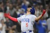 Chicago Cubs' Christopher Morel celebrates skyward after hitting a grand slam during the fifth inning of a baseball game against the San Diego Padres, Tuesday, April 9, 2024, in San Diego. (AP Photo/Denis Poroy)