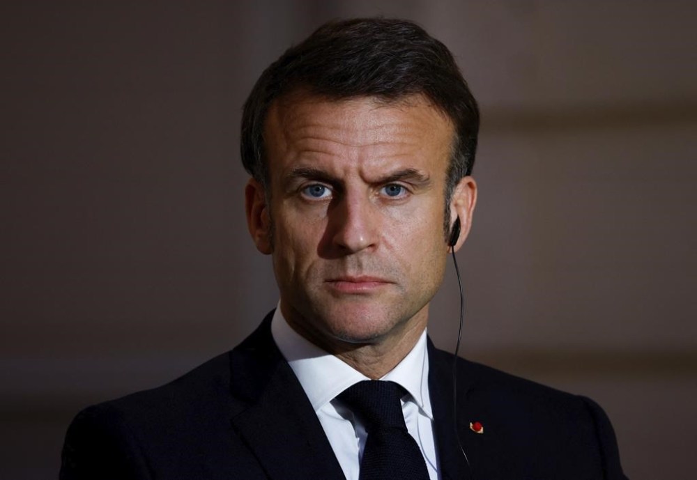 FILE - French President Emmanuel Macron looks on during a joint statement with Serbian President Aleksandar Vucic, before a working dinner at the Elysee Palace in Paris, Monday, April 8, 2024. France's government presented a bill Wednesday April 10, 2024 to allow adults with terminal cancer or other incurable illness to take lethal medication, amid growing public demand for legal options for aid in dying. Many French people have travelled to neighboring countries to seek such medication where medically assisted suicide or euthanasia are legal. French President Emmanuel Macron has long promised such a bill. (Sarah Meyssonnier/Pool via AP)