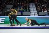Manitoba-Carruthers skip Brad Jacobs, right, delivers a rock as second Derek Samagalski, back left, and lead Connor Njegovan, front left, sweep while playing Team Manitoba-Dunstone during the playoffs at the Brier, in Regina, on Friday, March 8, 2024. Jennifer Jones and Brad Jacobs bounced back from lopsided tournament-opening losses with victories in Wednesday's early draw at the Grand Slam of Curling's Players' Championship. THE CANADIAN PRESS/Darryl Dyck