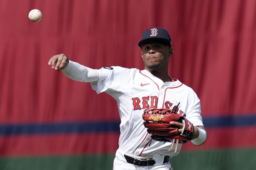 Boston Red Sox's Ceddanne Rafaela warms up before an opening-day baseball game against the Baltimore Orioles at Fenway Park, Tuesday, April 9, 2024, in Boston. The Red Sox finalized an eight-year contract Wednesday, April 10, 2024, with 23-year-old Ceddanne Rafaela, the youngest player on their roster. The deal includes a team option for 2032. (AP Photo/Michael Dwyer, File)