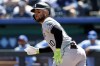 FILE - Chicago White Sox' Yoán Moncada (10) watches his hit to left field or a triple during the first inning of a baseball game against the Kansas City Royals in Kansas City, Mo., Sunday, April 7, 2024. Moncada will miss at least three months and maybe up to six with a severe hip injury sustained Tuesday night, April 9. Moncada suffered a strained adductor while running to first base in the second inning of Chicago’s 7-5 win over the Guardians. (AP Photo/Colin E. Braley, File)
