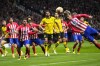 Atletico Madrid's Antoine Griezmann, right, heads the ball during the Champions League quarterfinal soccer match between Atletico Madrid and Borussia Dortmund at the Metropolitano stadium in Madrid, Spain, Wednesday, April 10, 2024. (AP Photo/Manu Fernandez)