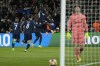 PSG's Ousmane Dembele, right, celebrates after scoring his side's opening goal during the Champions League quarterfinal first leg soccer match between Paris Saint-Germain and Barcelona at the Parc des Princes stadium in Paris, Wednesday, April 10, 2024. (AP Photo/Lewis Joly)