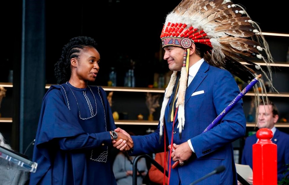 Manitoba Premier Wab Kinew greets Uzoma Asagwara, deputy premier, minister of Health, Seniors and Long-Term Care as Asagwara is sworn-in at a Premier and cabinet swearing-in ceremony in Winnipeg, Wednesday, Oct. 18, 2023. New security staff are scheduled to be in place at Manitoba's largest hospital on Monday in a bid to reduce violence. THE CANADIAN PRESS/John Woods