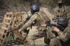 Members of the Siberian Battalion, which was formed mostly of volunteer Russian citizens, of the Ukrainian Armed Forces' International Legion, practice during military exercises, amid Russia's attack on Ukraine, at an undisclosed location in Kyiv region, Ukraine, Wednesday, Apr. 10, 2024. (AP Photo/Efrem Lukatsky)