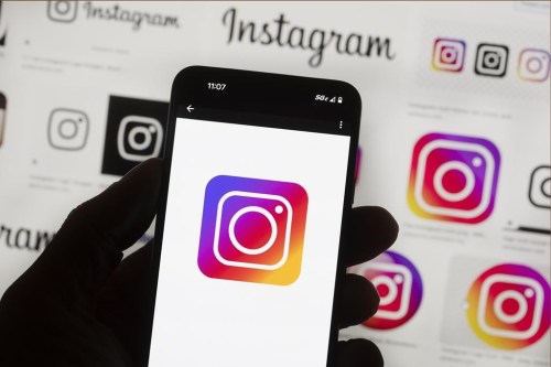 File - The Instagram logo is seen on a cell phone in Boston, USA, Oct. 14, 2022. Instagram says it’s testing out new tools to protect young people and combat sexual extortion, including a feature that will automatically blur nudity in direct messages. The social media platform said in a blog post on Thursday, April 11, 2024 that the new features are part of its work to fight sexual scams and other forms of “image abuse” and to make it tougher for criminals to contact teens. (AP Photo/Michael Dwyer, File)