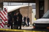Authorities work at the scene where a tornado damaged several businesses Wednesday, April 10, 2024, in Katy, Texas. (Jon Shapley/Houston Chronicle via AP)