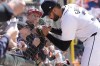 Detroit Tigers outfielder Riley Greene signs autographs before the first inning of a baseball game against the Oakland Athletics, Saturday, April 6, 2024, in Detroit. (AP Photo/Carlos Osorio)