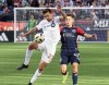 Toronto FC defender Shane O'Neill (27) defends the ball against New England Revolution forward Esmir Bajraktarevic (47) in the second half of an MLS soccer match Sunday, March 3, 2024, in Foxborough, Mass. THE CANADIAN PRESS/AP-Mark Stockwell