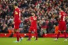 Liverpool's Mohamed Salah, center, reacts after Atalanta scoring their side's third goal during the Europa League quarter final first leg soccer match between Liverpool and Atalanta, at the Anfield stadium in Liverpool, England, Thursday, April 11, 2024. (AP Photo/Jon Super)