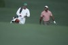 Tiger Woods walks with his caddie on the 13th hole during the first round at the Masters golf tournament at Augusta National Golf Club Thursday, April 11, 2024, in Augusta, Ga. (AP Photo/Ashley Landis)