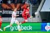 Augsburg's Arne Maier, left, and Union Berlin's Brenden Aaronson challenge for the ball during the German Bundesliga soccer match between Union Berlin and Augsburg, at the WWK-Arena in Augsburg, Germany, Friday, April 12, 2024. (Tom Weller/dpa via AP)