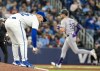 Toronto Blue Jays pitcher Paolo Espino reacts as Colorado Rockies left fielder Nolan Jones (22) rounds the bases on his solo homer in fifth inning interleague MLB action on Friday April 12, 2024. THE CANADIAN PRESS/Frank Gunn