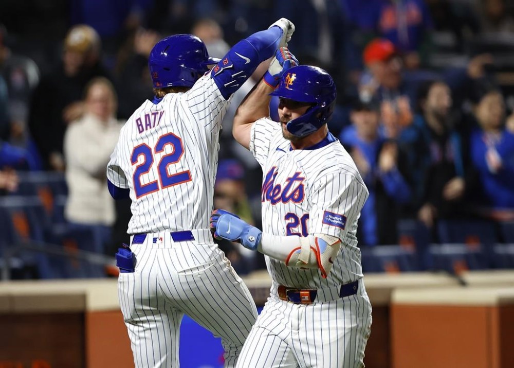 New York Mets' Pete Alonso (20) celebrates with Brett Baty (22) after hitting a home run against the Kansas City Royals during the ninth inning of a baseball game, Friday, April 12, 2024, in New York. (AP Photo/Noah K. Murray)