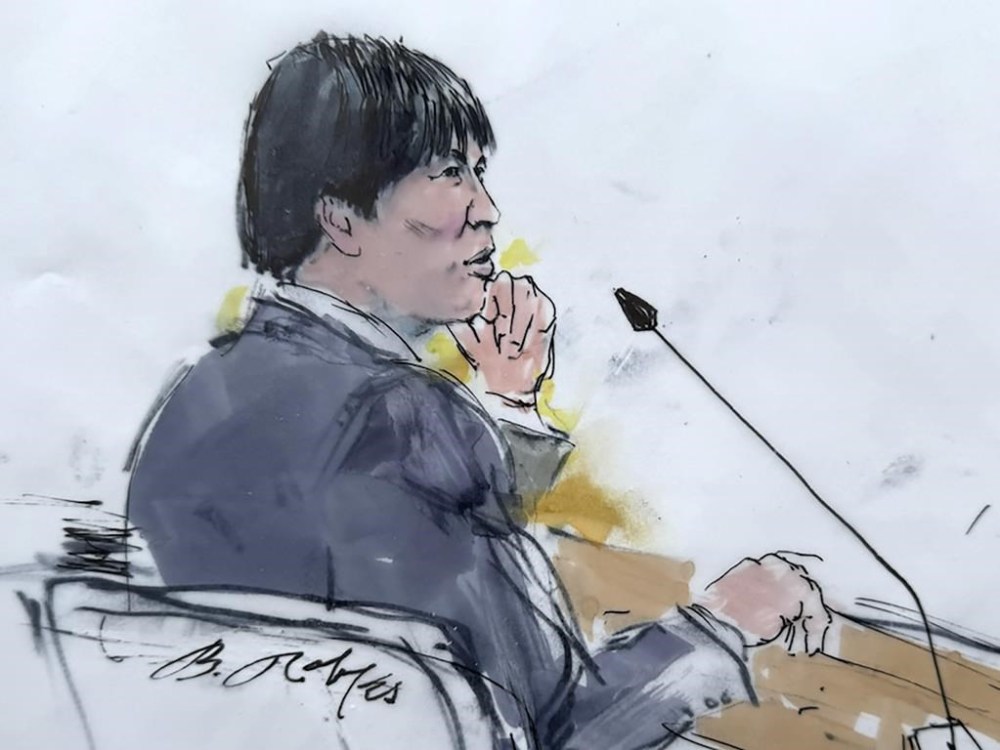 In this courtroom sketch, Ippei Mizuhara, the former longtime interpreter for the Los Angeles Dodgers star Shohei Ohtani appears in federal court in Los Angeles, Friday, April 12, 2024, on a single count of bank fraud. Prosecutors allege that Mizuhara stole more than $16 million from Ohtani to cover gambling bets and debts. (Bill Robles via AP)
